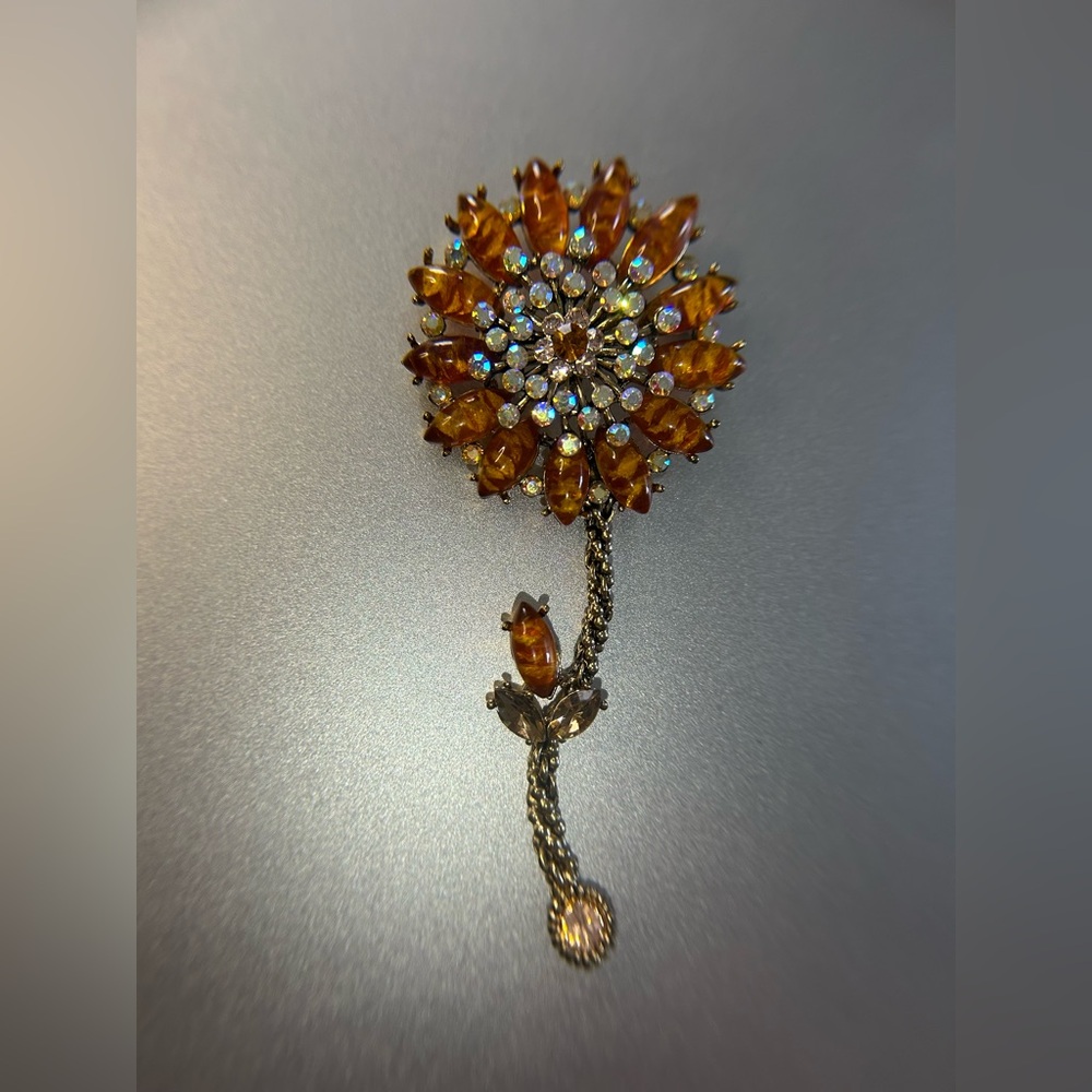 Large gold tone and faux crystal flower brooch